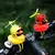 Bicicleta pequeno pato amarelo hélice capacete de pé pato quebrado vento