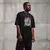 Camiseta Oversized Premium Branca e Preta Coleção César Tá em Casa Estampa Macaco Cesar