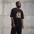 Camiseta Oversized Premium Branca e Preta Coleção César Tá em Casa Estampa Macaco Ensolarado - comprar online