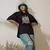 Camiseta Oversized Premium Branca e Preta Coleção César Tá em Casa Estampa Macaco Groove - Loja Apaoká