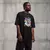 Camiseta Oversized Premium Branca e Preta Coleção César Tá em Casa Estampa Macaco Sorridente - Loja Apaoká