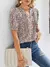 Blusa plisada de manga corta