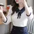 Blusa de encaje con cuello