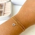 PULSEIRA DUPLA COM GOTA BANHADA A OURO 18K