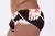 Side view of Hibisco low rise cut men's swim trunks featuring a black background with white and red floral patterns.