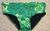 Aussie low rise swimwear in a striking green color with intricate floral designs