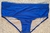 Royal blue classic swim trunks for men displayed on a textured surface.