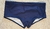 Blue navy boxer swim briefs for men displayed on a textured surface.