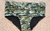 Camouflage classic swim trunks for men, featuring a camouflage pattern in shades of green and black.