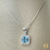 Imagem do CONJUNTO COM PEDRA AZUL CRAVEJADO DE ZIRCONIA EM VOLTA NA PRATA 925
