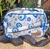 BANDOLERA/CARTERA NEOPRENE DE OJO TURCO BLANCO