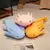 Axolote de peluche bonito en varios colores en internet