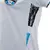 Camisa branca feminina do Grêmio II, modelo 24/25, com detalhes em preto e azul.