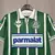 Camisa retrô verde do Palmeiras, temporada 94/95, com logotipo da Parmalat e detalhes em branco e verde.