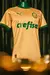 Camisa terceira do Palmeiras 24/25 em dourado e verde, exibida em um manequim.