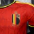 Camisa oficial da seleção da Bélgica para a Copa do Mundo 2026, modelo jogador masculino Adidas na cor vermelha com detalhes em amarelo