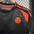 camisa-colombia-ii-away-24-25-torcedor-masculina-preta-com-detalhes-em-laranja