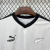 Camisa masculina branca da Nova Zelândia para a Copa de 2026, com detalhes em preto, logo Puma e símbolo da folha de samambaia