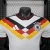 Camisa da Seleção da Alemanha para a Copa 2026, modelo jogador Adidas masculina na cor branca com design em preto, vermelho e amarelo