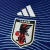 Camisa azul da seleção do Japão para a Copa de 2026, masculina, modelo torcedor da Adidas com logo da JFA no centro e detalhes em branco