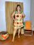 Vestido Curto com Amarração no Pescoço Estampa Raízes do Sol