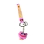 LLAVERO DE GOMA SMILING CRITTERS POPY ROSA CLARO - comprar online