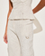 CALÇA DELLIA OFF WHITE na internet