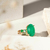 ANEL OVAL DE FUSION ESMERALDA ARO CRAVEJADO COM CRISTAL RUBI, CRISTAL TANZANITA E PARAIBA - loja online