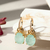 BRINCO EARBLING OVAL DE FUSION TURMALINA LIGHT E ZIRCÔNIAS BRANCAS - comprar online
