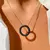 CONJUNTO BRINCO E COLAR REDONDO VAZADO CRAVEJADO DE ZIRCÔNIAS NEGRAS 50CM - comprar online