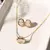 CONJUNTO DE BRINCO E COLAR OVAL COM ZIRCÔNIAS BRANCAS 48CM