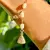 PULSEIRA NOSSA SENHORA APARECIDA COM PÉROLAS COREANAS E ZIRCÔNIAS BRANCAS 20CM