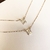 Colares com medalhinhas de São Bento em ouro 18k, apresentando design quadrado.