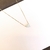 Colar em ouro 18K com pingente em forma de coração cravejado em zircônias brilhantes.