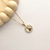 Colar em ouro 18K com pingente de Nossa Senhora cravejado em zircônias cristalinas e azuis.