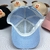 Boné Infantil Unissex Cachorrinho Cute com Orelhas em 3D Aba Curva Tamanho Ajustável Tecido Confortável - loja online