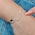 Pulseira de Prata Dois Fios Deslumbrante Corações Cravejados
