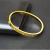 Bracelete Aço Dourado Relevo Circular na internet