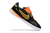 Chuteira Nike Streetgato Futsal em preto e laranja e a sola branca.