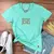 Camiseta Feminina Verde Menta Jesus Cruz Glitter