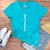 Camiseta Feminina Turquesa Cruz Prata Jesus Cristo