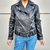 Campera de cuero rockera para mujer con cuello solapa, vista frontal cerrada.