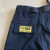 Calça Corteiz “ Corteiz Black White Logo Yellow Patch Cargo” - tienda online