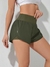 Imagen de SHEIN Running Shorts esportivo de cintura larga com bainha em forma de golfinho, shorts elástico