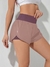 Imagen de SHEIN Running Shorts esportivo de cintura larga com bainha em forma de golfinho, shorts elástico