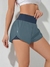 SHEIN Running Shorts esportivo de cintura larga com bainha em forma de golfinho, shorts elástico on internet