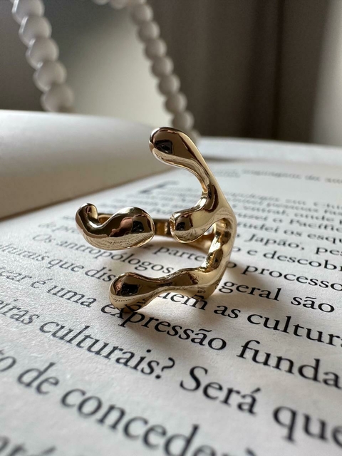 Anel garra folheado ouro 18k