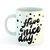Taza blanca con la frase "Have a nice day" en negro, decorada con puntos negros.