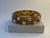 MAX BRACELETE MARROM COM PEDRAS METÁLICAS