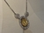 COLAR CRAVEJADO NOSSA SENHORA PRATA E DOURADO na internet